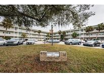 Building exterior, ample parking, lush landscaping at 2071 Australia W Way # 17, Clearwater, FL 33763