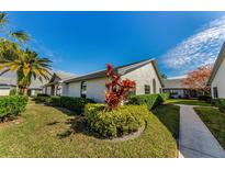 Charming single-story home with manicured landscaping and a walkway at 2749 Countryside Blvd # 18, Clearwater, FL 33761