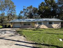 Ranch style home with carport and yard at 37329 Hannah Ln, Zephyrhills, FL 33542