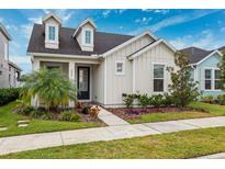 Two-story house with welcoming front porch at 3809 Lajuana Blvd, Wesley Chapel, FL 33543
