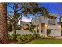 Stunning two-story home with landscaped yard and two-car garage at 4845 W Sunset Blvd, Tampa, FL 33629