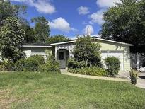 Ranch-style home with a one-car garage and well-manicured lawn at 5109 Gateway Dr, Tampa, FL 33615