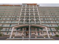 Exterior view of Windsor building, featuring a multi-story structure with balconies and a covered entrance at 6020 Shore S Blvd # 411, Gulfport, FL 33707