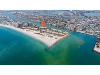 Beautiful aerial view of beachfront condos with amazing Gulf views and sandy beach access in desirable location at 7537 Bayshore Dr # 406, Treasure Island, FL 33706