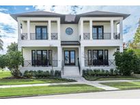 Stunning two-story home with white exterior and black accents at 200 Cordova Ne Blvd, St Petersburg, FL 33704