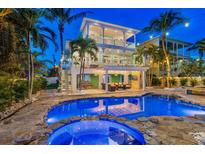 Stunning pool and patio area with a hot tub, perfect for entertaining at 644 Boca Ciega Isle Dr, St Pete Beach, FL 33706