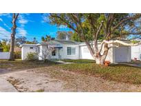 Charming single story home with mature landscaping and driveway at 229 Lime S Cir, Dunedin, FL 34698