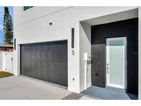 Modern home with attached garage and stylish front door at 2608 W Columbus Dr # 5, Tampa, FL 33607