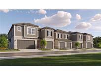 Modern townhouses with attached garages and well-manicured lawns at 10816 Fort White Ct, Tampa, FL 33647