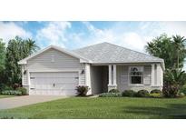 One-story home with gray siding, white garage door, and landscaping at 14960 Serene Shores Loop, Bradenton, FL 34211