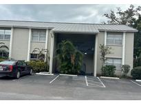 Condo building exterior with parking and landscaping at 306 S Habana Ave # 7, Tampa, FL 33609