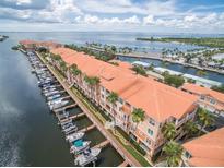 Stunning aerial view of waterfront condos with boat docks and access to the bay at 5000 Culbreath Key Way # 2-202, Tampa, FL 33611