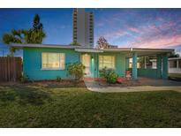 Charming aqua-colored single-story home featuring a covered carport and well-maintained front lawn at 925 67Th S St, St Petersburg, FL 33707