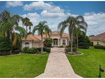 Beautiful one-story home with tile roof and lush landscaping at 34303 Sahalee Loop, Dade City, FL 33525