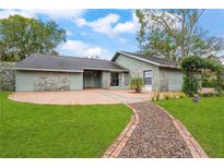 Ranch style home with stone accents and a brick walkway at 4606 Ridgecliff Dr, Brandon, FL 33511