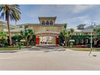 Elegant community entrance with landscaped archway at 501 Knights Run Ave # 1213, Tampa, FL 33602