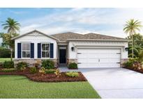 One-story home with a two-car garage, landscaping, and shutters at 7815 Wheat Stone Dr, Zephyrhills, FL 33540
