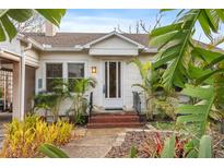 Charming white bungalow with a well-maintained front yard at 17 Venetian Ct, Tarpon Springs, FL 34689