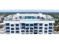 Stunning aerial view of a luxury building with rooftop pool and city views at 2910 W Barcelona St # 2102, Tampa, FL 33629