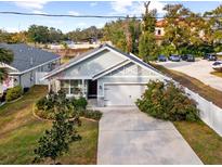 Aerial view of a newly built home with a spacious backyard and driveway at 37137 Florida Ave, Dade City, FL 33525