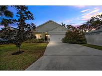 Charming craftsman style home with a landscaped front yard and attached two-car garage at 37137 Florida Ave, Dade City, FL 33525