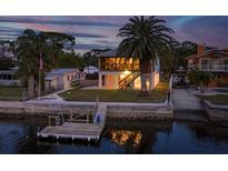 Elevated view of waterfront home with private dock and surrounding landscape at 4536 Heavens Way, New Port Richey, FL 34652