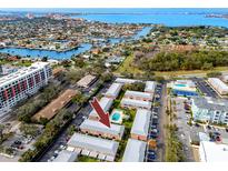 Aerial view of condo community showing building location, pool, and tennis court at 3475 41St S Ter # 215, St Petersburg, FL 33711