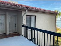 Exterior view of condo building, showing entrance and balcony at 6218 Palma Del Mar S Blvd # 208, St Petersburg, FL 33715