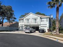 Two-story townhome with attached garage and private balconies at 8313 Shallow Creek Ct, New Port Richey, FL 34653