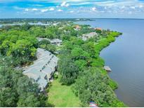 Aerial view of waterfront community with lush landscaping and private docks at 1111 N Bayshore Blvd # B7, Clearwater, FL 33759