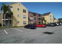 Apartment building with parking lot and palm trees at 11901 4Th N St # 10105, St Petersburg, FL 33716