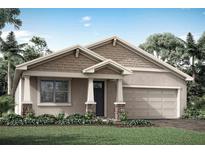 Beautiful craftsman style home with a two-car garage and landscaped front yard at 12436 52Nd E St, Parrish, FL 34219