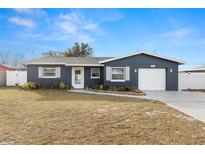 Charming ranch-style home with a well-maintained lawn and updated facade at 29836 69Th N Way, Clearwater, FL 33761