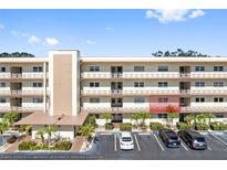 Two-story condo building with ample parking at 5705 80Th N St # 210, St Petersburg, FL 33709