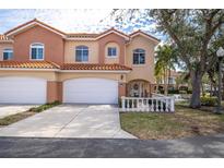 Two-story townhome with double garage and landscaped front yard at 6224 Vista Verde W Dr, St Petersburg, FL 33707