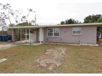 One-story house with a covered porch and well-maintained lawn at 10591 116Th Ter, Largo, FL 33773