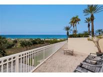 Oceanfront balcony with patio furniture, offering stunning ocean views at 1200 Gulf Blvd # 102, Clearwater Beach, FL 33767