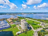 Luxury waterfront condo building with resort-style amenities, marina, and stunning water views at 130 Riviera Dunes Way # 605, Palmetto, FL 34221