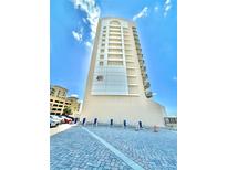 High-rise building with ocean views and chairs at 450 S Gulfview Blvd # 408, Clearwater Beach, FL 33767