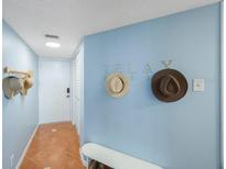 Bright entryway with tiled floor and bench at 6051 Sun Blvd # 504, St Petersburg, FL 33715