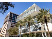 Modern building featuring sleek lines, floor-to-ceiling windows, and palm trees enhancing its contemporary design at 145 2Nd S Ave # 616, St Petersburg, FL 33701