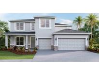 Two-story house with gray siding, stone accents, and a three-car garage at 4330 Pullet Ct, Bradenton, FL 34211