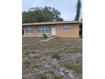 Tan single story house with a small front yard at 5130 Dr Martin Luther King Jr St S, St Petersburg, FL 33705