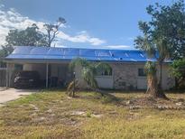 One-story house with tarp-covered roof, needs repairs at 3120 Smith Ave, Bradenton, FL 34207