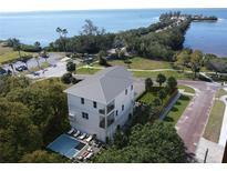 Coastal home with pool, private backyard, and stunning water views at 96 Shore Dr, Tarpon Springs, FL 34689