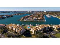 Aerial view of waterfront community with pool and boat slips at 2795 Kipps Colony S Dr # 104, St Petersburg, FL 33707