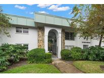 Tiffany Gardens condo building, featuring a well-maintained exterior and landscaping at 3100 Hartford N St # 224, St Petersburg, FL 33713