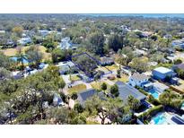 Aerial view showing a large lot in a residential neighborhood near water at 4710 W San Rafael St, Tampa, FL 33629