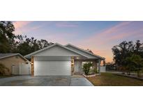 Updated one-story home with a two-car garage and landscaped lawn at 7101 69Th N St, Pinellas Park, FL 33781