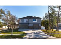 Contemporary two-story home with a two-car garage and stone accents at 1600 Pennsylvania Ne Ave, St Petersburg, FL 33703